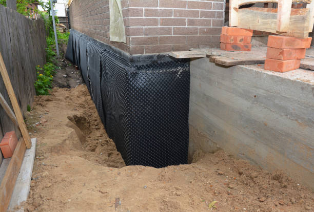Happy homeowners after waterproofing job in Young America